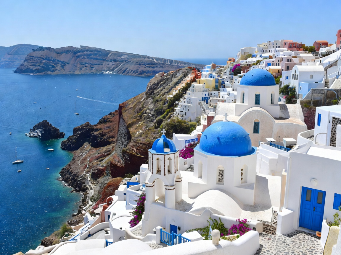White and blue buildings overlooking the caldera in Santorini Greece